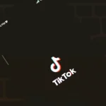 Person creating TikTok username on smartphone showing character requirements by using quick counter tools tool.