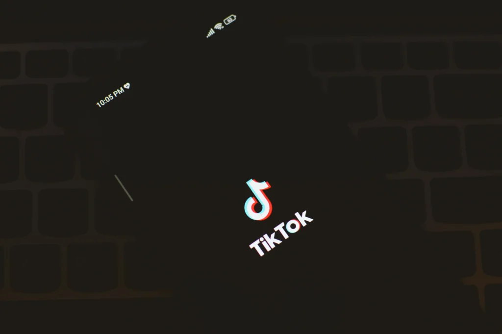 Person creating TikTok username on smartphone showing character requirements by using quick counter tools tool.