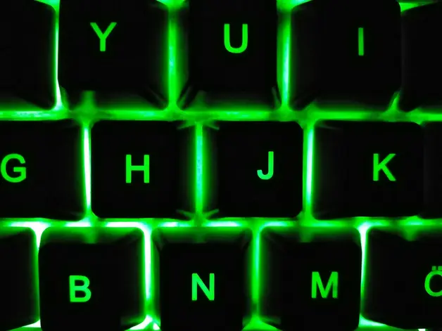 Green backlit gaming keyboard for creating tryhard gaming nicknames on QuickCounterTools.